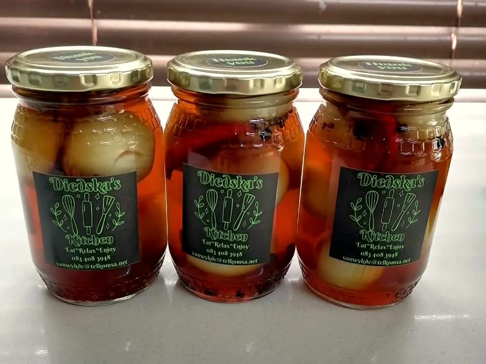 Three jars of spiced pickled onions