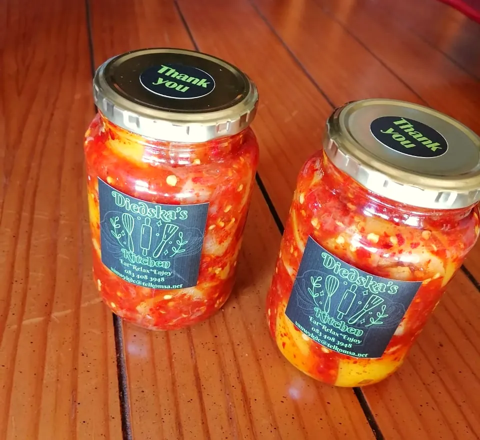 Two jars of chopped red chilli relish